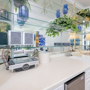 Mix up refreshing beverages at the sleek wet bar while enjoying views of the lively living area