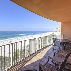 Relax on the spacious balcony, soaking in the gentle breeze and captivating views of the beach