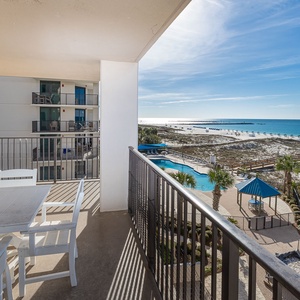 Sip your favorite drink at the balcony table while enjoying splendid views of the coast and surrounding pool