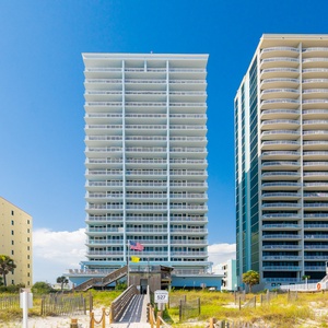 Discover stunning beachfront views and relaxing palm-lined pathways at The Colonnades in Gulf Shores