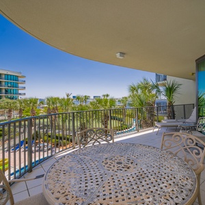 Relax on the balcony, surrounded by palm trees, soaking in the warm sun, and enjoying gentle coastal breezes