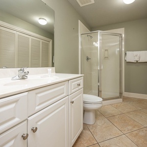 Refresh in this additional guest bath with a walk-in shower and laundry area with a washer and dryer in your rental