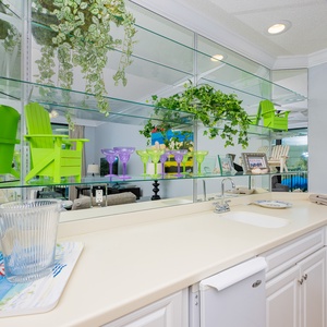 Enjoy refreshing beverages from the wet bar while surrounded by cheerful decor and a welcoming atmosphere