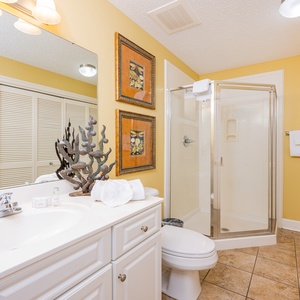 Refresh in this additional guest bath with a walk-in shower and laundry area with a washer and dryer in your rental