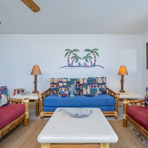 Unwind in the vibrant living area, featuring comfortable seating and tropical decor that invites relaxation and enjoyment
