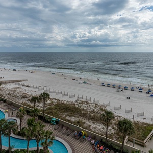 Savor the relaxing vibe on your balcony, where beach views and gentle sounds invite you to unwind and recharge
