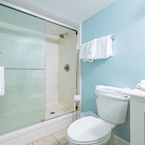 Refreshing yourself in the master bath, you'll feel invigorated by the calming coastal vibes all around you