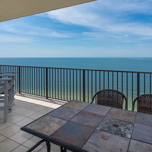 Sip your morning coffee at the stylish table while taking in breathtaking views of the coast