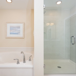 Indulge in relaxation with a spacious jetted tub and a separate glass shower, complemented by soft decor