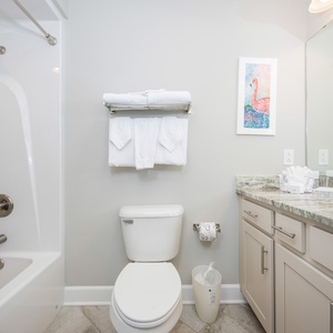 Freshen up in this guest bath in the relaxing shower or soothing tub before an exciting beach day