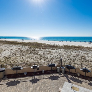 Grill and relax at the pool area while enjoying the serene view of the beach and sparkling water just steps away
