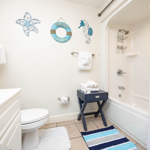 Freshen up in this guest bath in the relaxing shower or soothing tub before an exciting day