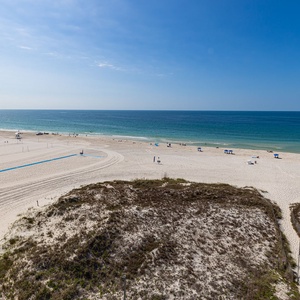 Gaze at the stunning coast view from your balcony, where beach vibes invite relaxation and cherished moments