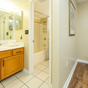 Rest towels await on the vanity as you prepare for a refreshing bath in the master bath
