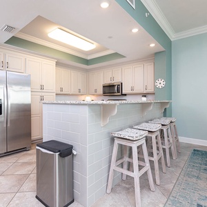 Gather with loved ones at the stylish breakfast bar, enjoying the open feel of the inviting kitchen