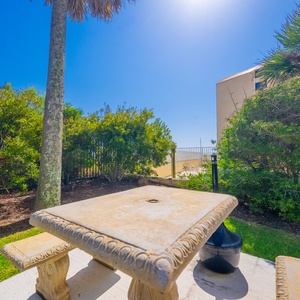 Relax in the outdoor grilling area, perfect for cookouts with friends and family, just steps from the beach