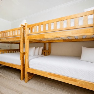 Guests will sleep comfortably in this bunk room featuring sturdy double bunk beds, perfect for kids