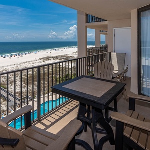 Enjoy your morning coffee on the balcony, overlooking the beach and vibrant blue waters