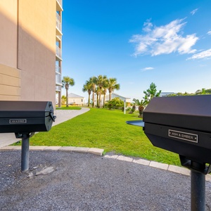 Grill your favorite meals while taking in the serene beach view from this lovely outdoor space at The Dunes