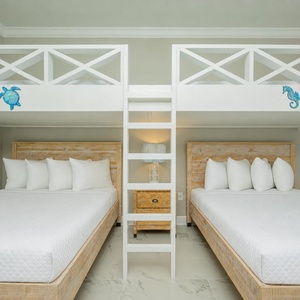 Enjoy a fun stay in this guest bunk room with two queen beds below and a cozy loft areawith twins above