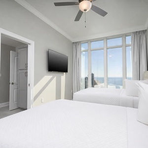 Unwind in this queen guest suite and stream your favorite shows or enjoy a good movie after a beach day