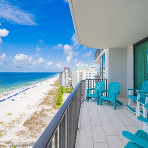 Fresh gulf air from your balcony while seated in vibrant chairs, overlooking the beach and gentle waves