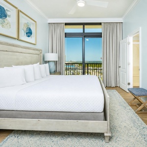 Unwind in this king guest suite, where soft bedding invites relaxation and views of the coast inspire calm moments