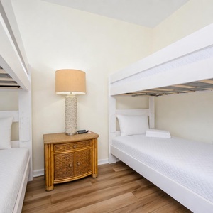 Twin over twin bunk beds frame the guest suite where you can unwind and recharge after a day of adventure
