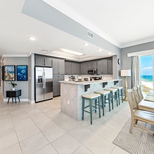 Enjoy this stylish kitchen space while the gulf glitters beyond the dining room windows