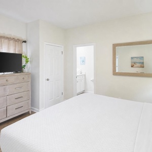 Experience restful nights in the guest suite, with a cozy vibe enhanced by soft lighting and coastal-inspired decor