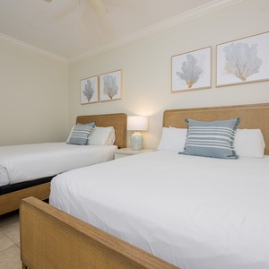 Experience restful nights on the queen beds in this guest room, surrounded by tranquil decor, for a peaceful beach retreat