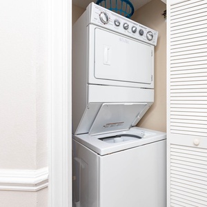 Washer and dryer combo tucked neatly in a closet, providing convenient laundry access during your beach getaway