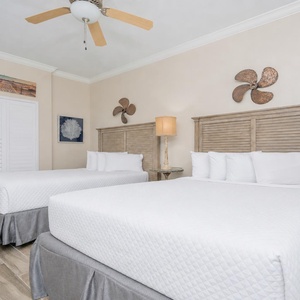 Rest in the plush queen bedding of this cozy guest room, creating the perfect retreat for restful nights by the coast