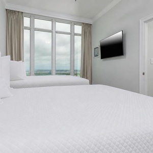 Settle onto one of the queens and spot flamingo art by the doorway while the gulf stretches beyond the windows