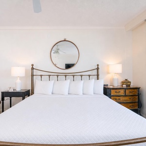 Enjoy restful nights in the master suite with soft king bedding and fluffy pillows