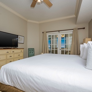 Unwind in the plush king bedding as you enjoy a good movie in the master, feeling the relaxed beach vibe
