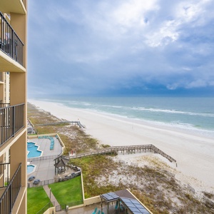 Enjoy breathtaking views from the balcony overlooking the pristine beach, perfect for relaxation and unwinding