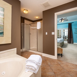 Indulge in relaxation in the master bath with a refreshing walk-in shower and soothing jetted tub