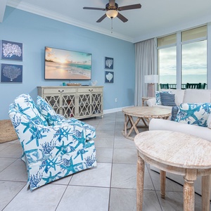 Relax in stylish seating, enjoying coastal views and the tranquil sounds that fill the inviting living space