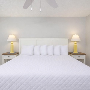 Enjoy relaxation in this king guest suite, surrounded by soft linens and calming decor, as tranquility envelops you