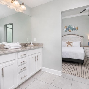 Freshen up in this guest bath in the relaxing shower or soothing tub before an exciting beach day