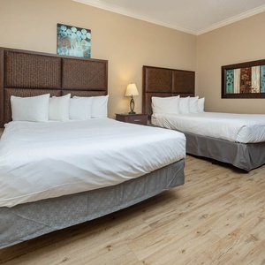 Relax on one of the cozy queen beds in this guest suite and enjoy a peaceful slumber