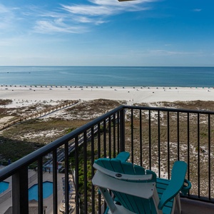 Balcony seating offers a serene view of the beach and gentle waves, perfect for relaxation and enjoying the coastal breeze