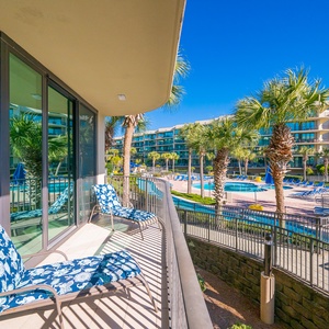 Breathe in the warm breeze on the balcony, soaking up views of swaying palms and the inviting lazy river below