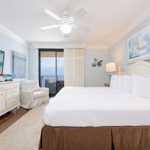 Calm blue walls soothe the master suite as you relax and watch shows on the wall TV