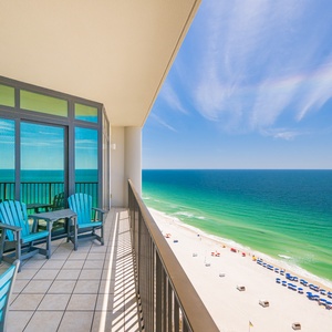 Savor joyful moments with loved ones on your balcony, soaking in vibrant coastal views and refreshing beach vibes
