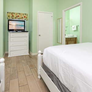 Unwind in this guest room with two beds, a TV, and a vibrant coastal decor for a relaxing stay