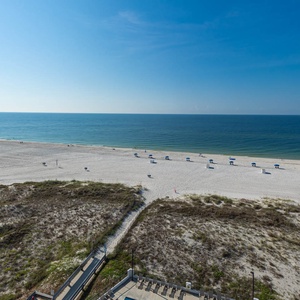 Enjoy stunning beachfront views from this inviting space, perfect for relaxation and unwinding by the shore