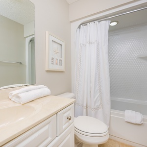 Refresh and rejuvenate in this guest bath, enjoying the soft towels and a soothing shower