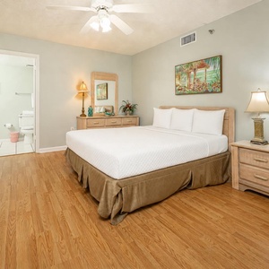 Feel refreshed in this inviting queen guest suite, where soft bedding await you after a beach day